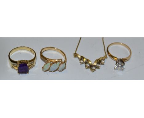 A three stone opal doublet ring, irregular set, 14ct gold shank;  another amethyst ;  a dress ring;  a necklace; 14.7g gross 