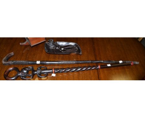 African Art - an ebony shaft, carved with elephants;  a walking stick;  an ebony dish;  a carved figural chain (4)