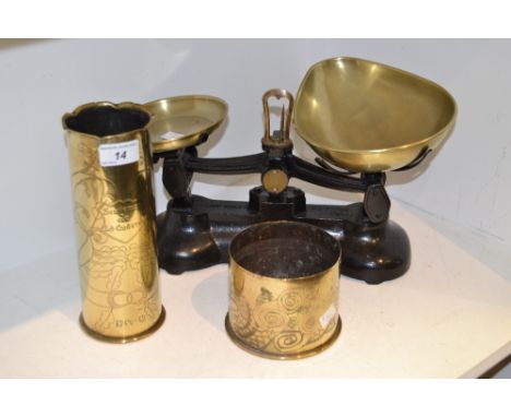 Brassware - a cast iron and brass set of kitchen scales; a trench art brass shell case vase; another, smaller stamped 1914, e