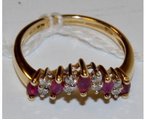 A diamond and ruby ring, wishbone crest, encrusted with alternating oval ruby's and pairs of diamond accents, stamped 585, ye