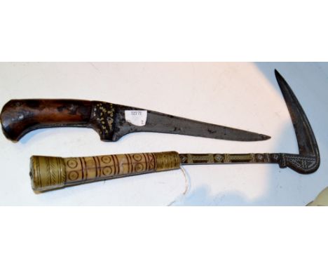 An Indo-Persian pesh kabz dagger, 19cm pointed single-edged blade, the spine and ferule damascened in gold and silver coloure