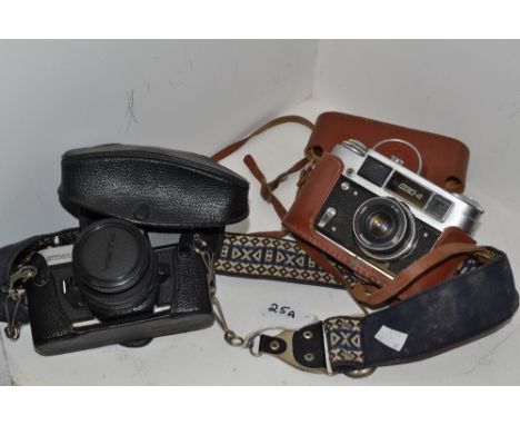A Fujica STX1 camera; another (2)