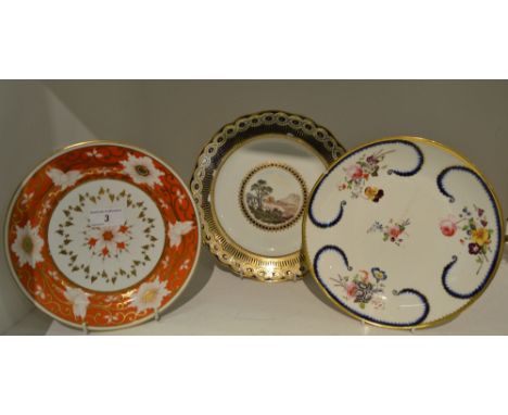 A Derby shaped circular plate, the field painted with country house within a blue beaded cartouche, the sides with ovals and 