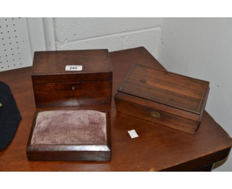 A post-Regency rosewood work box, c.1830; an early Victorian rosewood rectangular pin cushion; a Victorian rosewood tea caddy