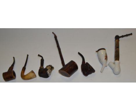 A novelty pipe, carved as a bull; another, stamped Merisier, Vosges; others, various (6) 