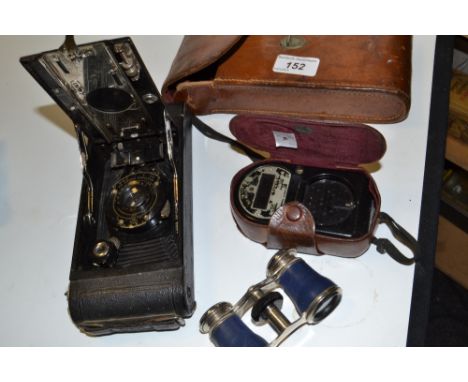 An Eastman Kodac A116 folding bellows camera, brown leather case,  a light meter;  a pair of opera glasses (3)