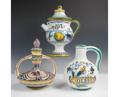 Group of three hand-painted ceramic oil and vinegar jugs, showcasing traditional Italian and Portuguese craftsmanship. Includ