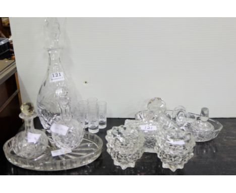 Group of mainly cut glass items – decanter, shot glasses, 2 vinegar bottles, candle holders