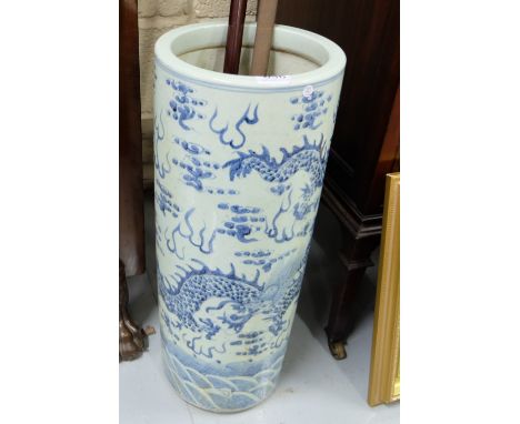 Blue and White Porcelain Stick Stand, decorated with Chinese dragons, 23”h x 9” dia