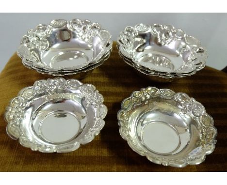 Matching set of 6 silver circular trinket dishes with fluted borders, 4" diameter and a similar pair of smaller dishes (none 