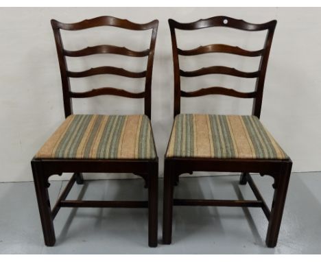 Set of 6 Ladder Back Mahogany Dining Chairs, including one carver, with drop in seats covered with stripped fabric, on stretc