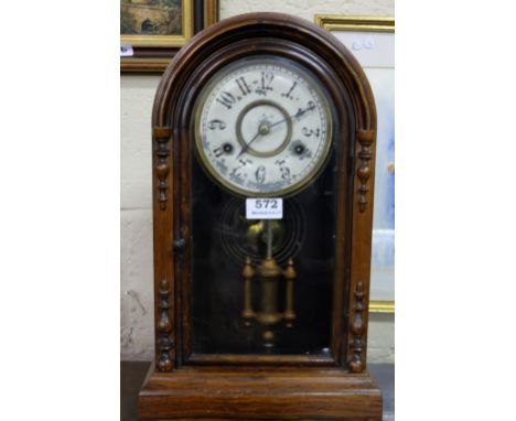 Walnut Cased Jerome Striking Mantle Clock, with visible pendulum