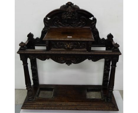 19thC Oak Stick Stand, carved with applied foliage carvings, apron drawer and 2 drip trays, 42”w x 47”h