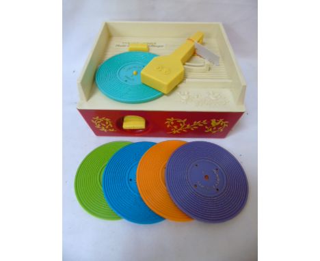 Retro fisherprice music box record player with records with a vintage ITT KB radio