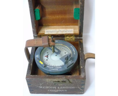 Wooden cased military medium landing compass bearing the crows foot emblum