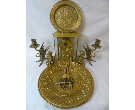 Pair of brass griffin candlesticks, carriage clock and other brass ware