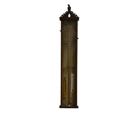 An Admiral Fitzroy Barometer, oak case with carved pediment, printed chart, 109cm.