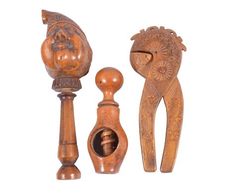 Treen nutcrackers including Boxwood nutcracker, designed as a head with a Phrygian cap, perhaps French, screw mechanism, 20cm