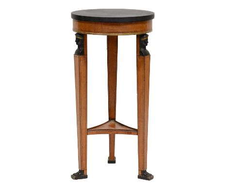 French Empire style satinwood torchere, circular ebonised top, figural legs joined by a shelf, diameter 42.5cm, height 86cm.C