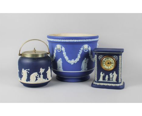 A Collection of Wedgwood and Other Blue and White Jasperware to include Large Planter, Biscuit Barrel and Mantel Clock, Plant