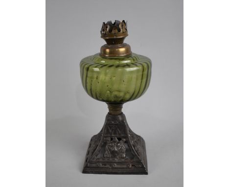 A Late Victorian Oil Lamp Base having Green Glass Reservoir on Cast Iron Stand with lion Mask Decoration 