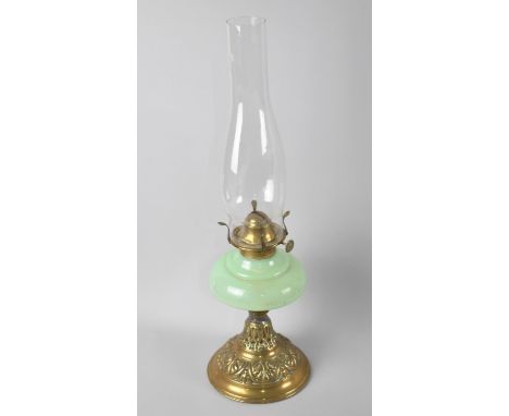 A Late 19th/Early 20th Century Brass Based Oil Lamp with Opaque Green Glass Reservoir and Plain Chimney, 48cms High Overall 
