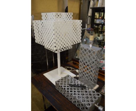 An unusual large white painted table lamp with pierced metal shade and two other lamps.