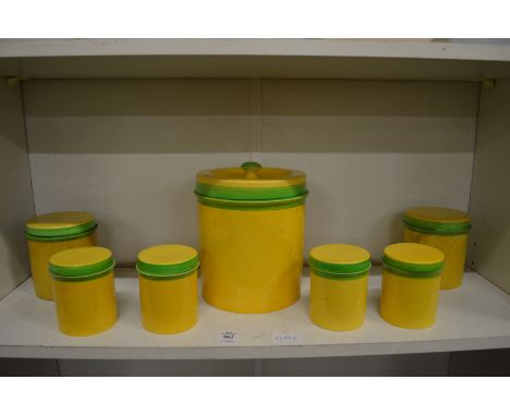 Carltonware storage jars, yellow ground with green rims.
