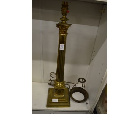 A brass corinthian column table lamp.