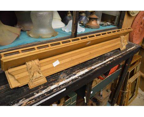 A pine wall shelf.