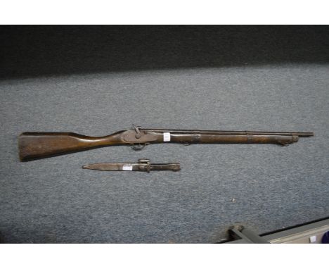 A model percussion gun and a bayonet.