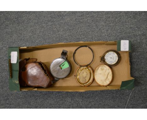 A pocket barometer and other items.
