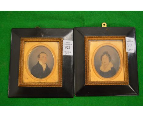 A pair of late Victorian portrait miniatures on card depicting a gentleman and a lady.