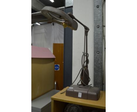 An old magnifying lamp.