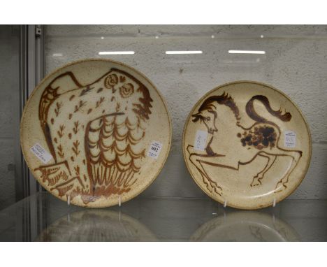 A circular studio pottery plate painted with an owl, possible by Michael Cardew, Kingwood Pottery, together with a similar pl