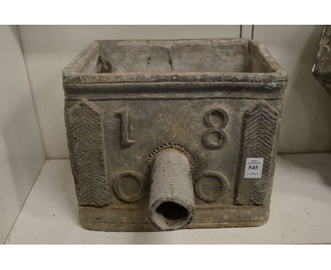 A lead rainwater hopper dated 1800.
