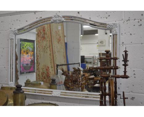 A decorative over mantle mirror.