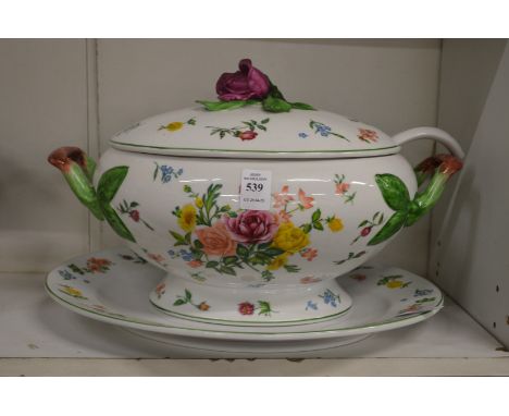 A floral decorated porcelain tureen, cover and stand complete with ladle.