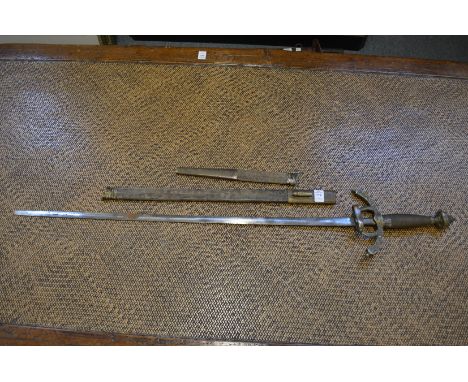 A sword and scabbard with tapering double edged blade, wire bound grip with ornate brass pommel and cross guard (scabbard a/f