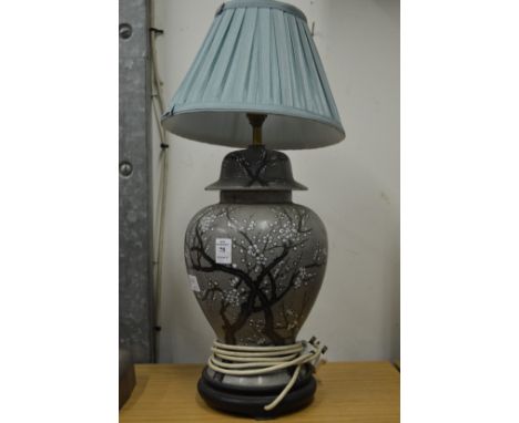 A Chinese pottery vase lamp.