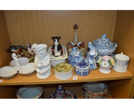 A shelf of decorative china.