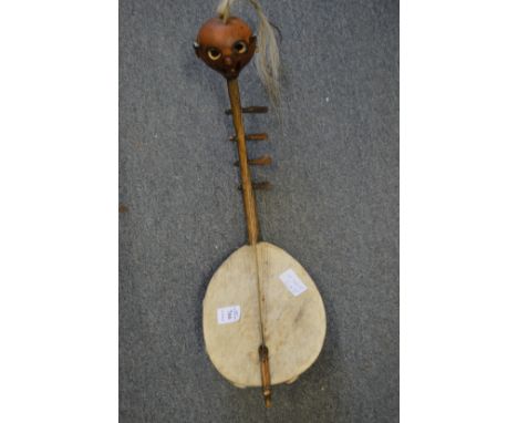 A small stringed musical instrument, possibly Ivory Coast.