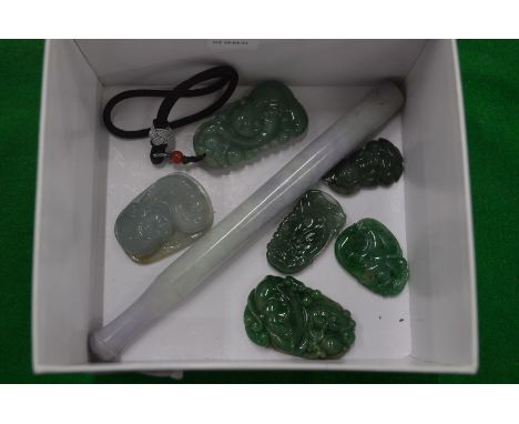 A collection of jade amulets and other items.