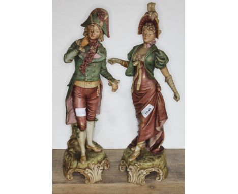 A pair of Royal Dux figures of Coutiers in 18th century dress, model numbers 113 &amp; 114, heights 45cm &amp; 47cm.  Conditi