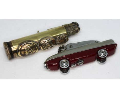 A trench art lighter and another formed as a car.  