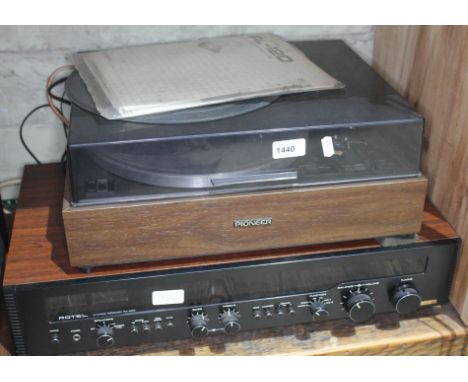 A Rotel RX602 Stereo Receiver separate together with a Pioneer PL-12D belt driven turntable with instructions manual.  