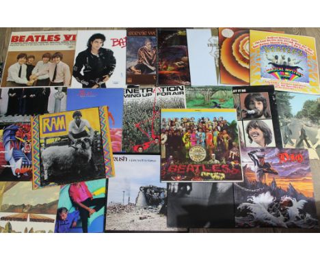 A collection of 27 vinyl LPs - various artists including Michael Jackson, Stevie Wonder, The Beatles, etc.  