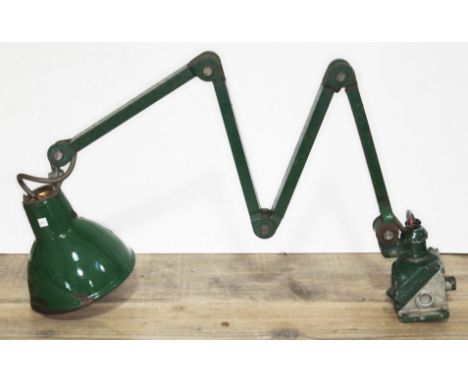 A vintage scissor action adjustable lamp.  
