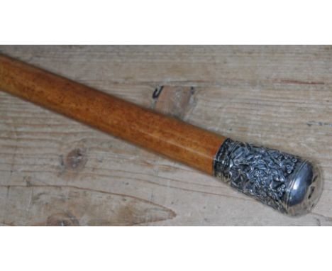 A malacca walking stick with Indian white metal top, length 84.5cm.  