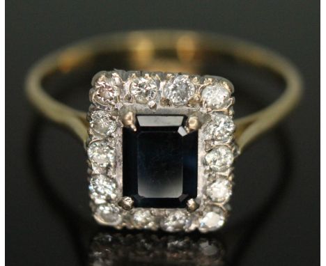 An Art Deco style diamond and sapphire ring, the emerald cut sapphire weighing approx. 1.32ct, band unmarked, gross wt. 4.74g